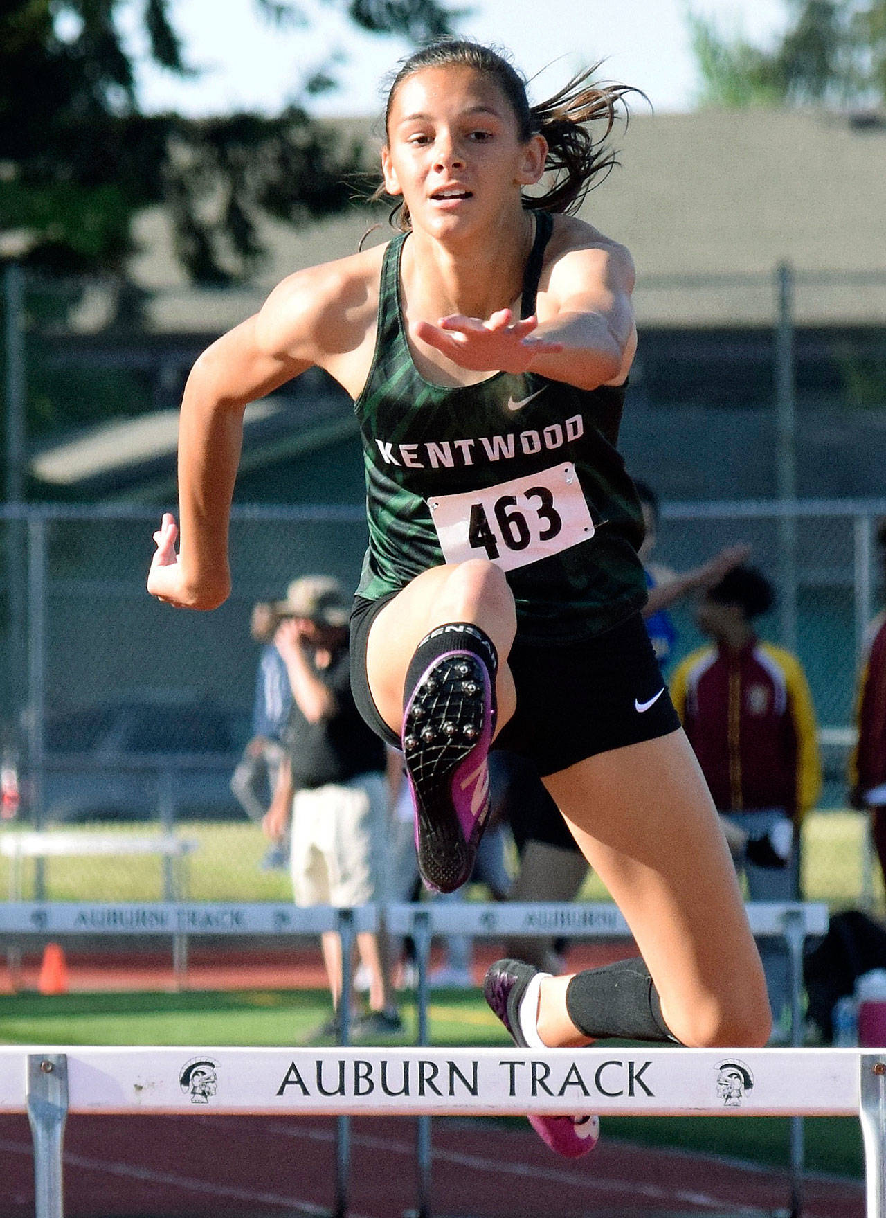 Kentwood sophomore Emma Pollak glides to victory in 300-meter hurdles at the North Puget Sound League track and field meet at Auburn Memorial Stadium on May 9. Pollak, who owns the state’s fastest time in the event at 44.11 seconds, won the league final in 45.39 to advance to this week’s West Central District meet at Sumner. RACHEL CIAMPI, Kent Reporter