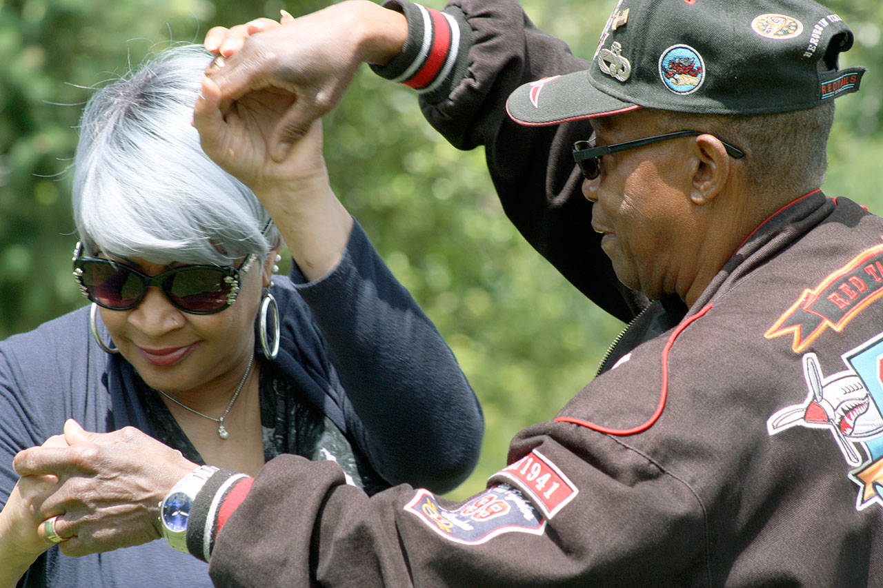 Marsha Love and Eddie Middleton dance to the music of Seattle jazz guitarist Michael Powers during the Linda Sweezer Memorial Juneteenth Festival and Celebration at Morrill Meadows Park last year. MARK KLAAS, Kent Reporter