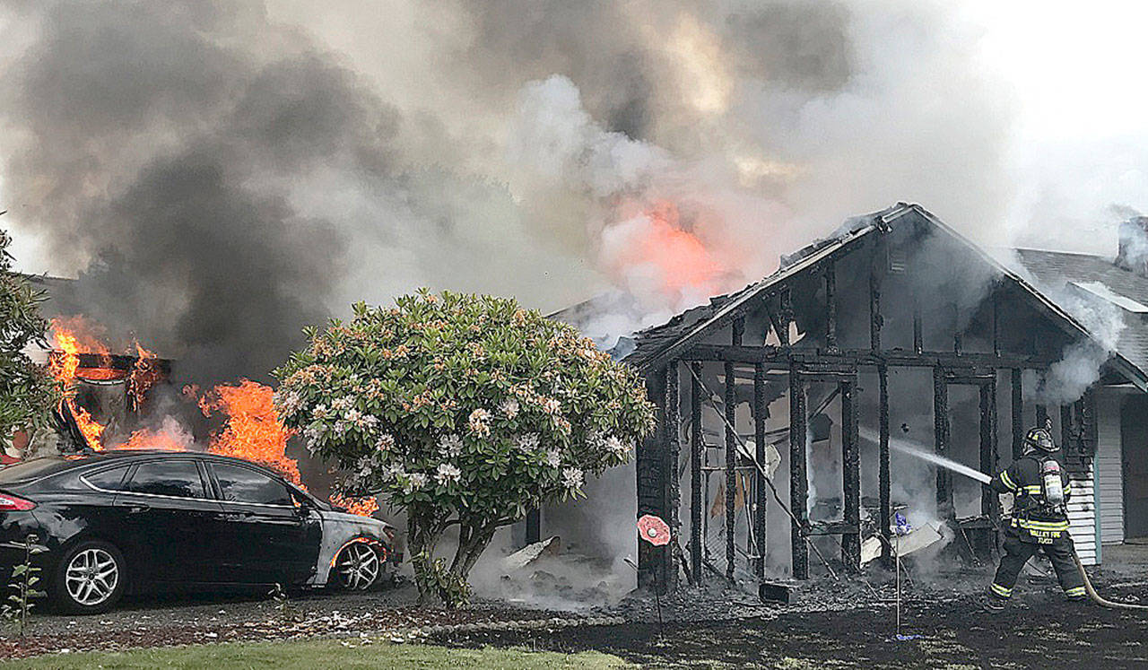 Firefighters battle a blaze Friday in Kent at a house in the 12400 block of SE 275th Place. COURTESY PHOTO, Puget Sound Fire