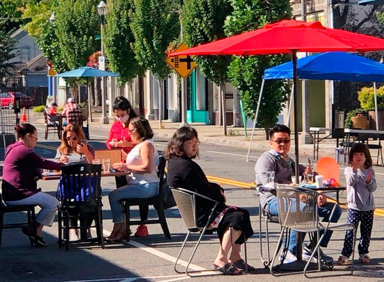 People take advantage in downtown Kent of the outdoor dining along First Avenue between Gowe and Titus streets on Saturday. The street is closed to vehicle traffic between 8 a.m. and 8 p.m. each Saturday. COURTESY PHOTO, Kent Downtown Partnership