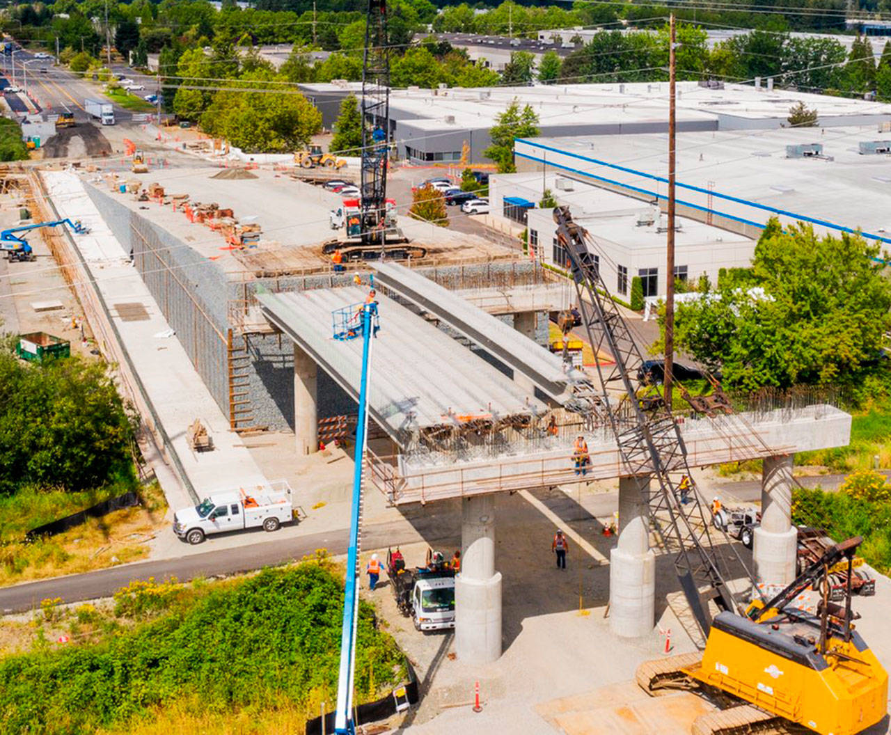 Crews place bridge girders on Aug. 3 for the South 228th Street overpass that will span the Union Pacific Railroad tracks and Interurban Trail. COURTESY PHOTO, Alex Klinger, City of Kent Public Works, via drone