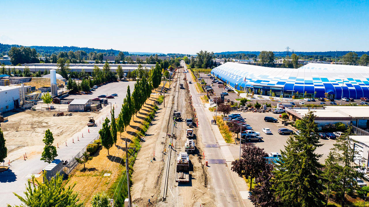 Crews work to raise 76th Avenue South by about 3 feet between South 212th Street and South 228th Street in Kent to stop the annual flooding problem along the road. Blue Origin’s headquarters is on the right. COURTESY PHOTO, City of Kent Public Works