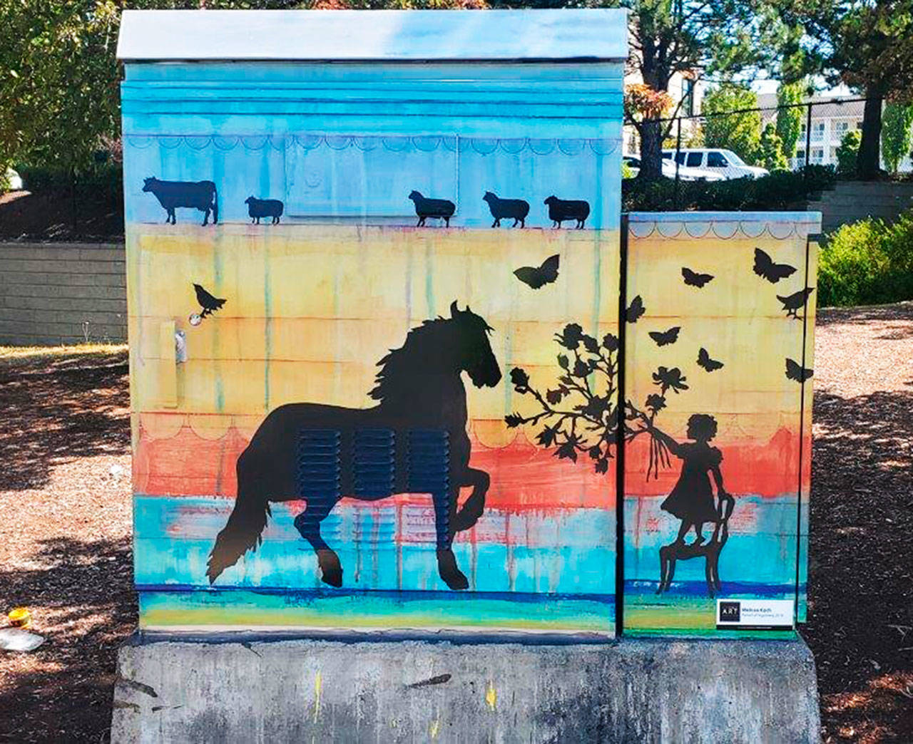 Whimsical silhouettes of animals and people appear on Melissa Koch’s box, “Pursuit of Happiness,” at State Route 99 (Pacific Highway South) and South 252nd Street. COURTESY PHOTO, City of Kent