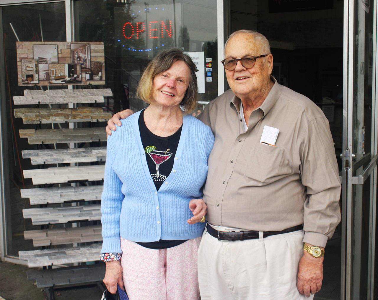 Steve and Jeannine Dowell stand outside the entrance Monday to Dowell Co., along Central Avenue North in Kent, just north of James Street. They have sold the store after more than 50 years in business. STEVE HUNTER, Kent Reporter