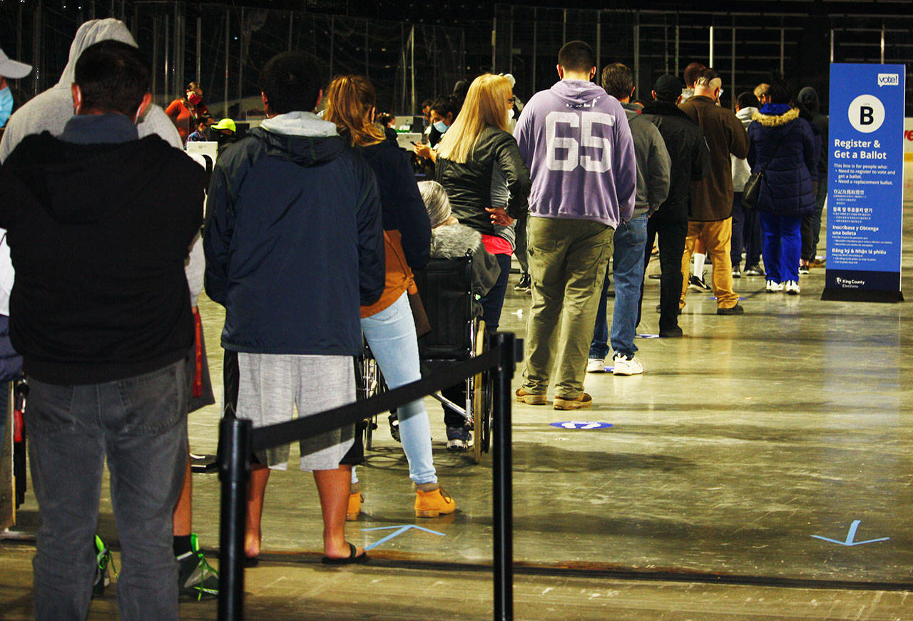 People line up to get ballots at the Vote Center Tuesday, Nov. 3 inside the accesso ShoWare Center. STEVE HUNTER, Kent Reporter