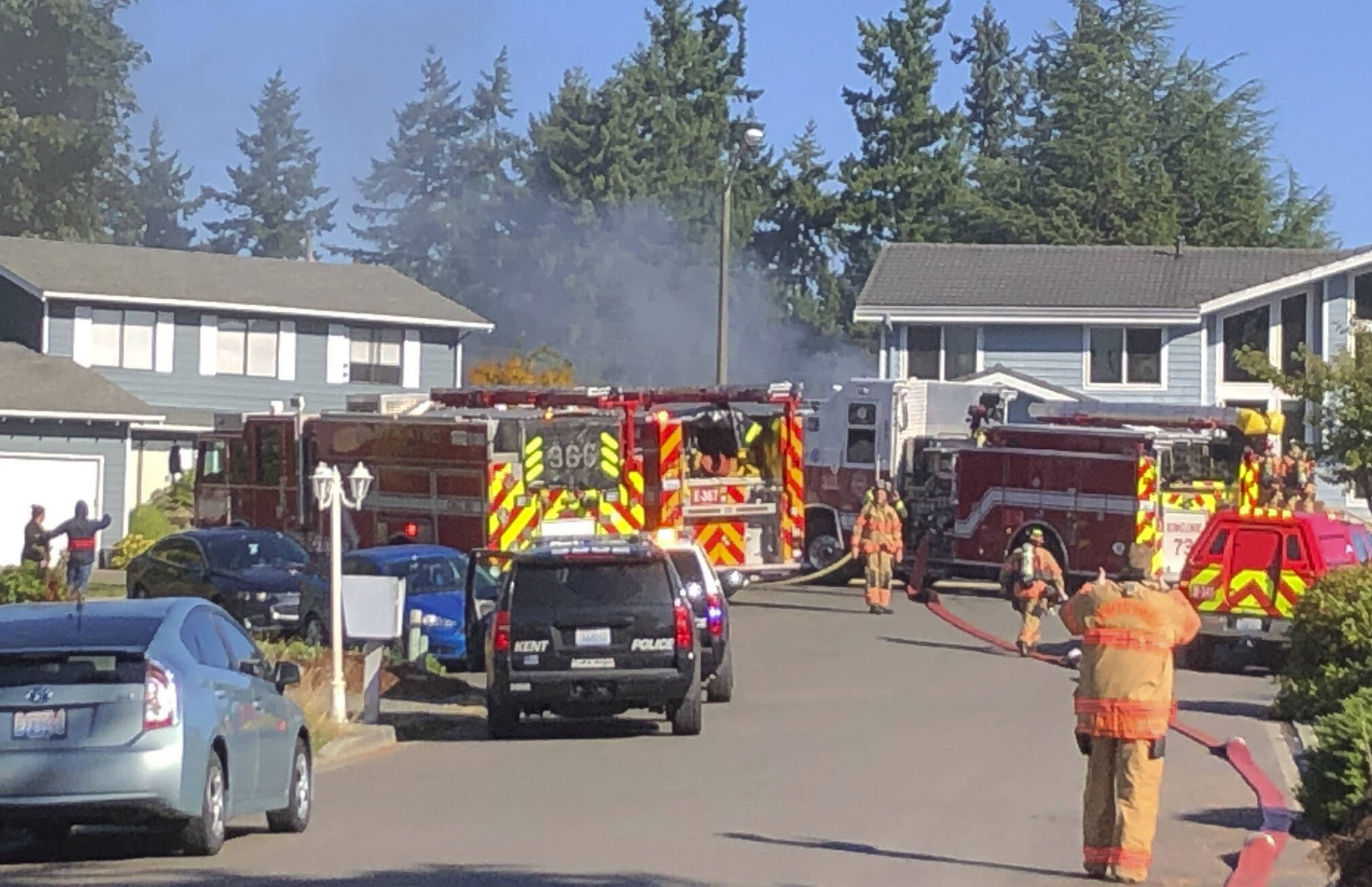 Puget Sound Fire firefighters extinguish a house fire the morning of Friday, Sept. 24 in the 25200 block of 37th Place South on Kent’s West Hill. COURTESY PHOTO, Puget Sound Fire