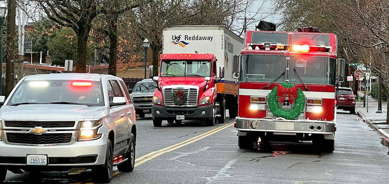 A semi full of toys receives a police and fire escort on Dec. 22 to Kent Lutheran Church to distribute the gifts. COURTESY PHOTO, Puget Sound Fire