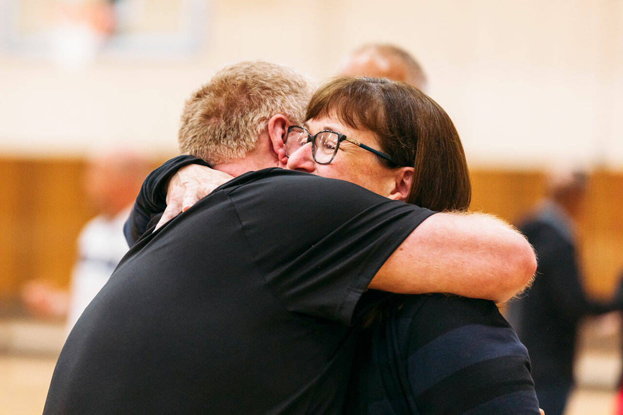 Lori Hogan receives a hug during a June 30 event to name the Kent Commons gym after her. COURTESY PHOTO, City of Kent