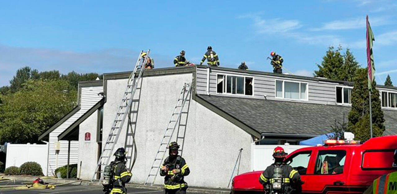 Firefighters extinguish an apartment fire Sunday, Aug. 21 in the 1200 block of West Smith Street. COURTESY PHOTO, Puget Sound Fire