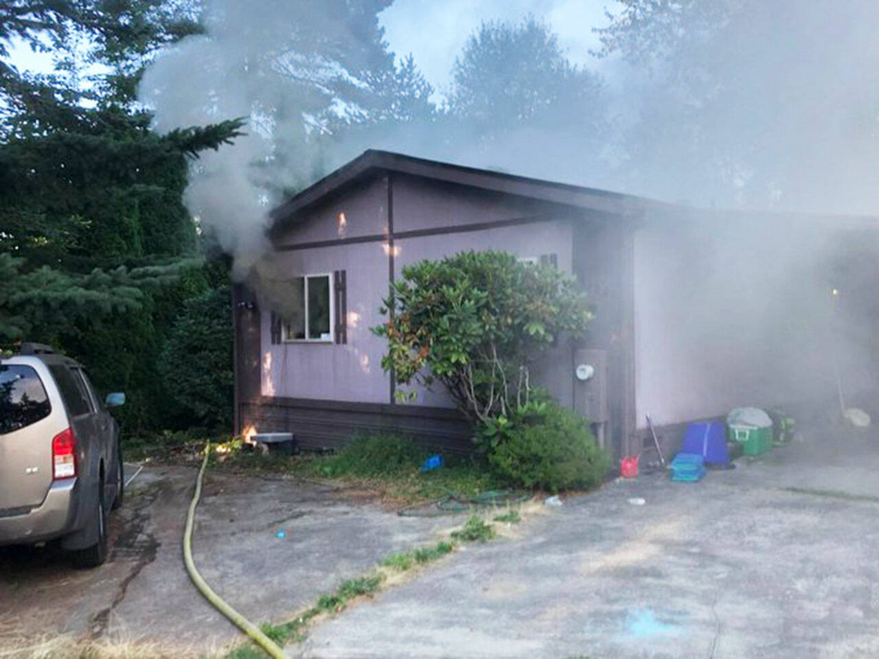 A fire damaged a home Monday evening, Aug. 22 in the 12200 block of SE 206th St. in Kent. COURTESY PHOTO, Puget Sound Fire