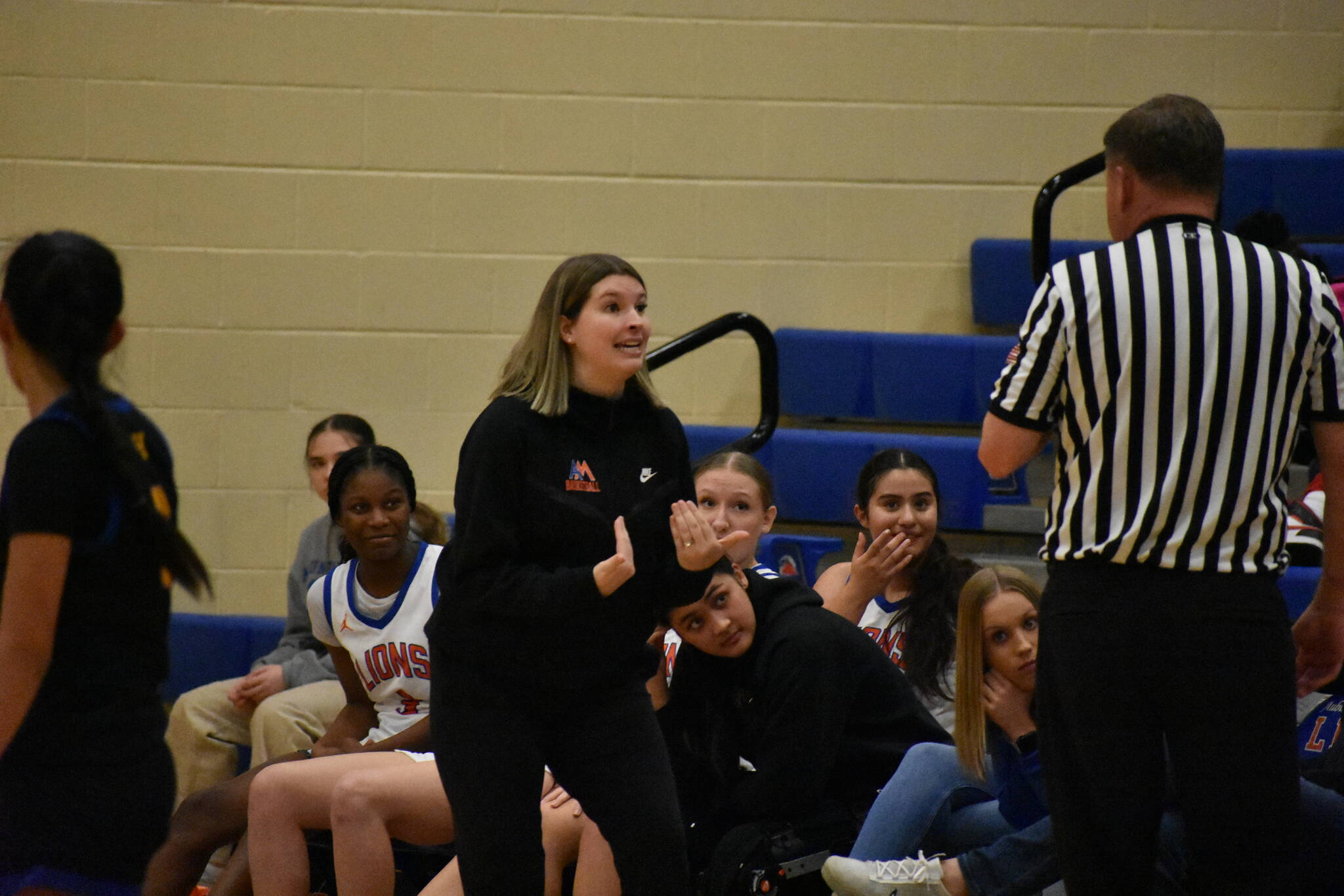 Auburn Mountainview Head Coach Alyse Lacey in an animated discussion with the referee. (Ben Ray / The Reporter)