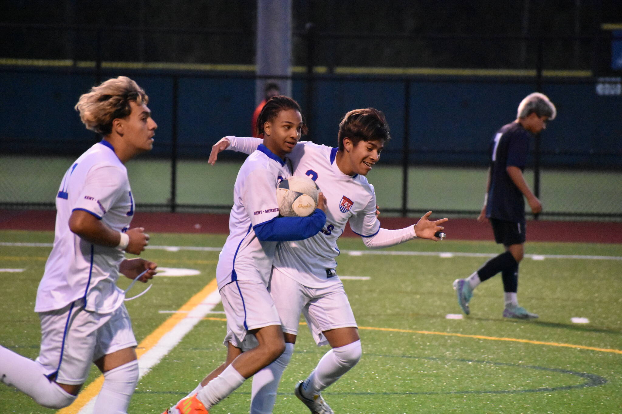 Johan Zuluaga gets some love from his teammates after scoring the game tying goal. Ben Ray / The Reporter