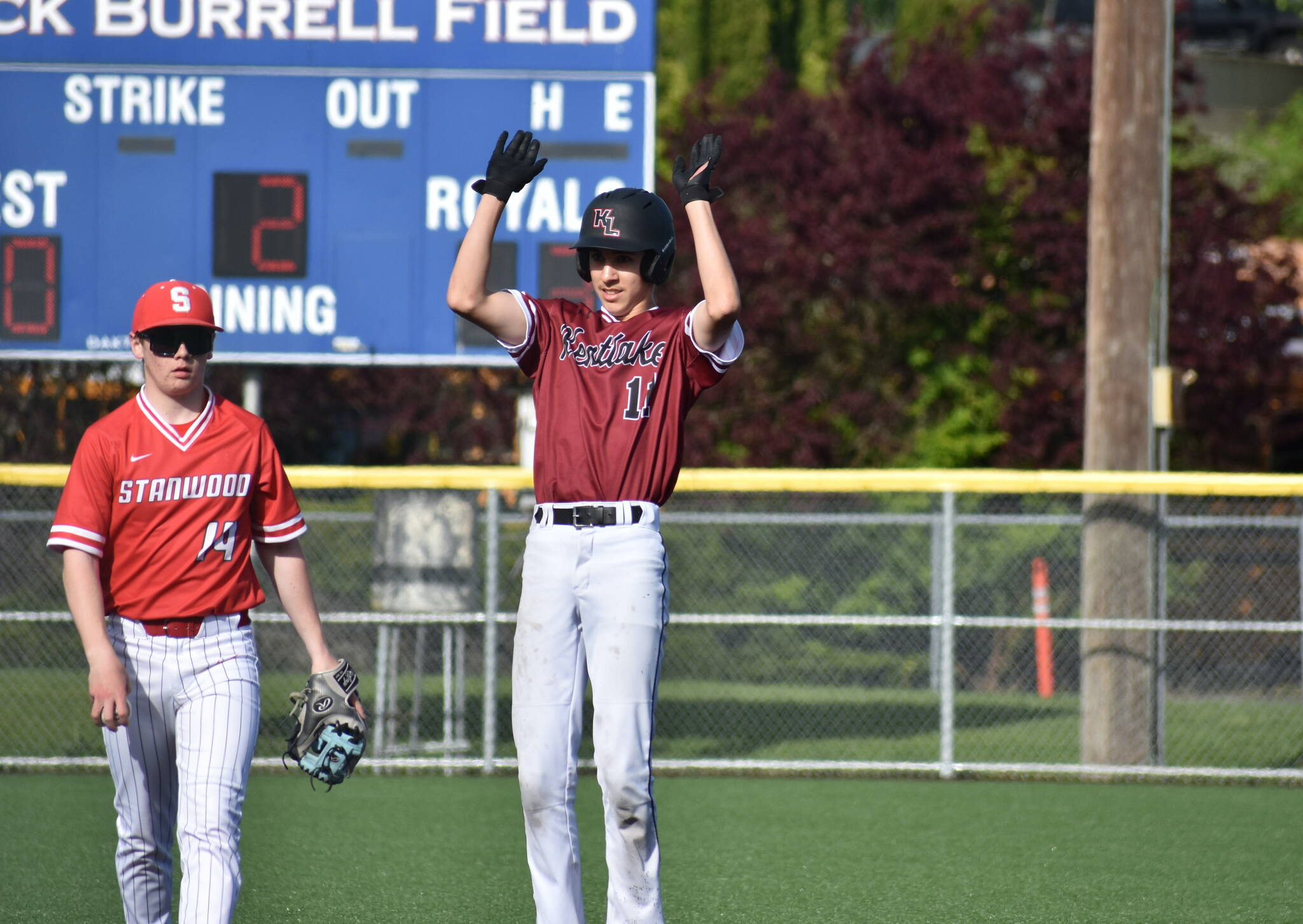 Matthew Ledbetter raises the roof against Stanwood after a double. Ben Ray / The Reporter