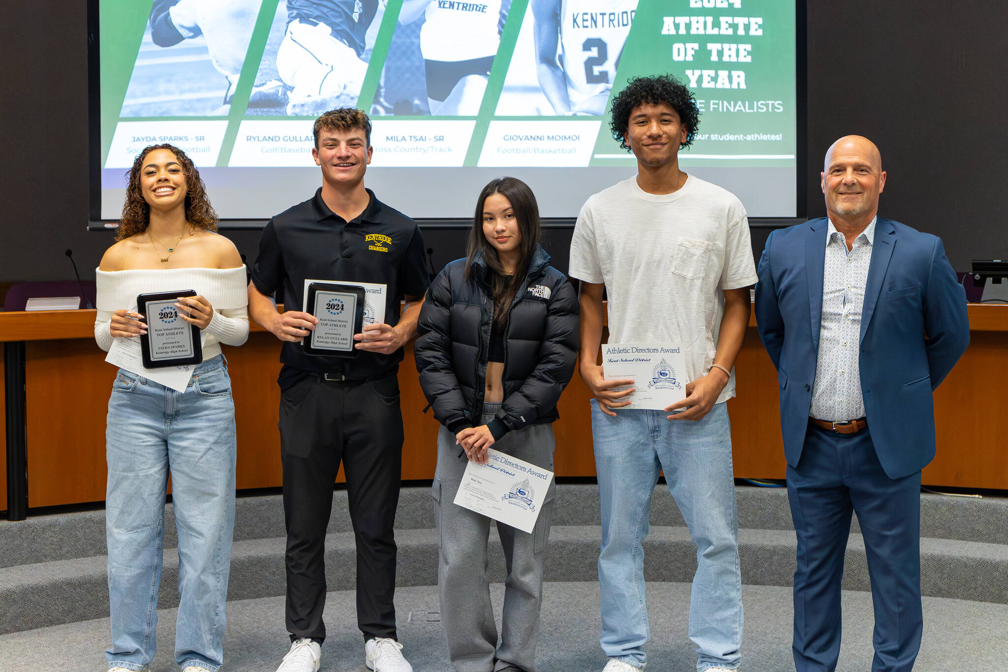 The four Kentridge nominees (Jayda Sparks, Rylan Gullard, Mila Tsai, Giovanni Moimoi) stand next to Brian Smith. Sparks and Gullard being awarded the top vote getters for Kentridge. Photo by Robby Mullikin