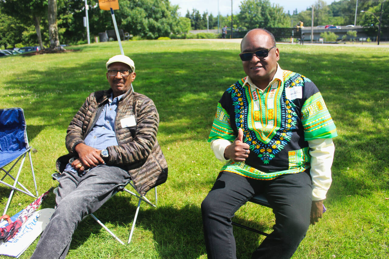 Volunteers enjoy the sunshine at Renton’s 2024 Juneteenth Celebration. The weather will be sunny this weekend as summer officially starts. Photo by Bailey Jo Josie/Sound Publishing