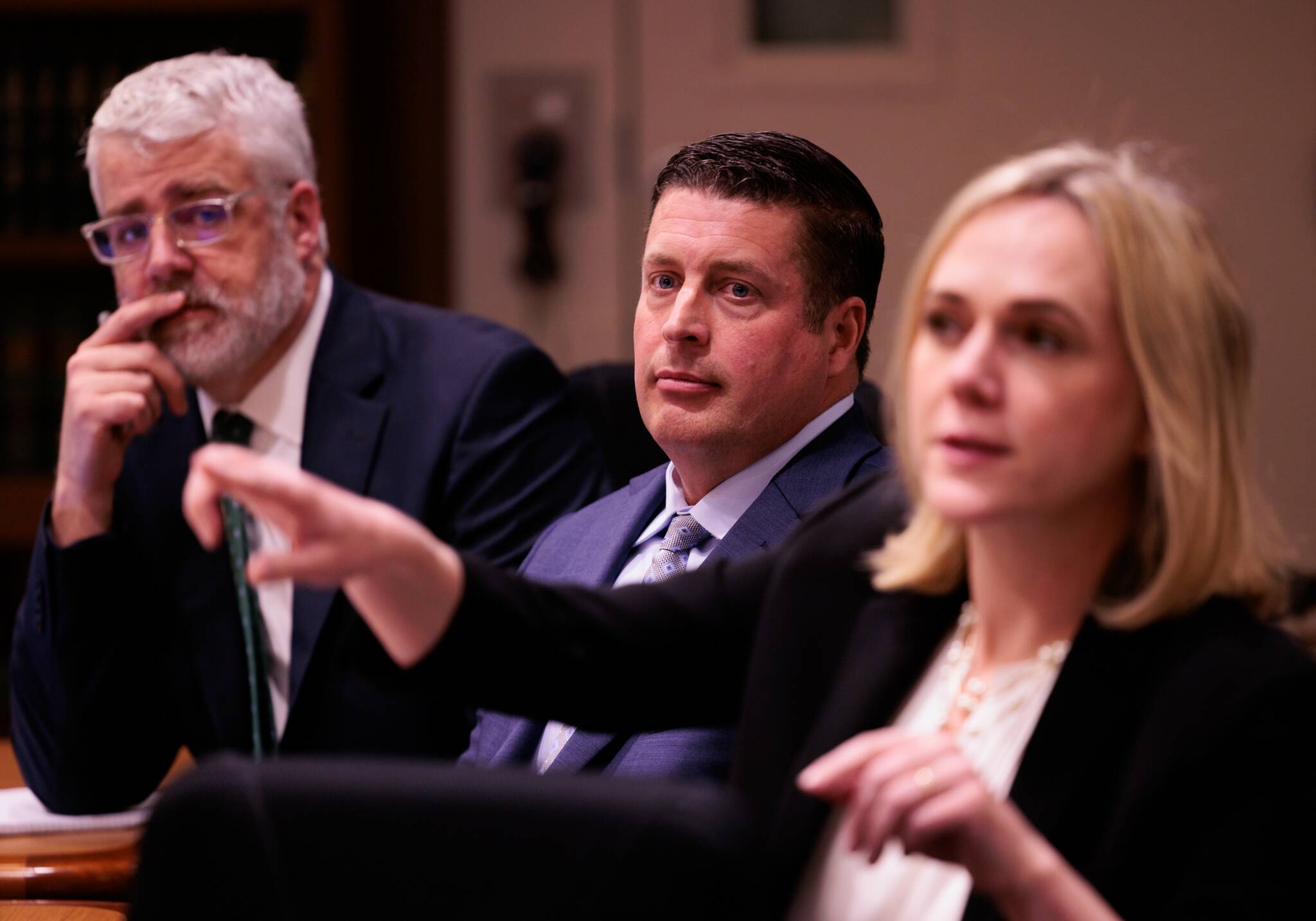 Auburn Police Officer Jeffrey Nelson, center, is flanked by two of his defense attorneys Tim Leary, left, and Emma Scanlan, right, during closing arguments at Maleng Regional Justice Center in Kent on Thursday, June 20, 2024. (Ken Lambert / The Seattle Times / Pool)