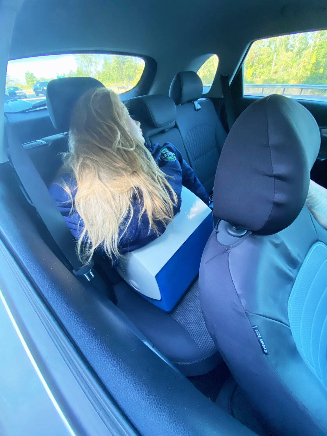 A State Patrol trooper ticketed a woman driver for speeding in the HOV lane of Interstate 5 in Kent and for an HOV violation. The woman had what she called a “training aid” in the vehicle in an effort to show she had a passenger to not violate the two-person rule for using the lane. COURTESY PHOTO, Washington State Patrol