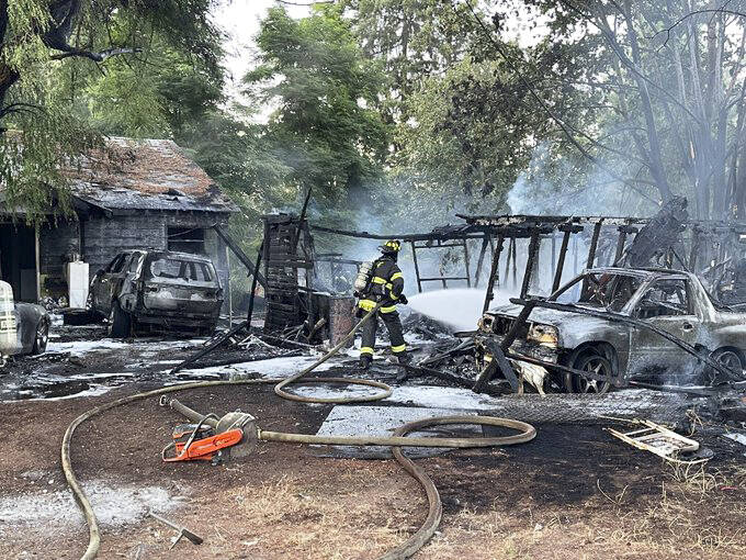 Fire damaged several vehicles Sunday, Aug. 4 in Kent after a shed fire in the 26500 block of 108th Avenue SE spread to the vehicles and the nearby house. COURTESY PHOTO, Puget Sound Fire