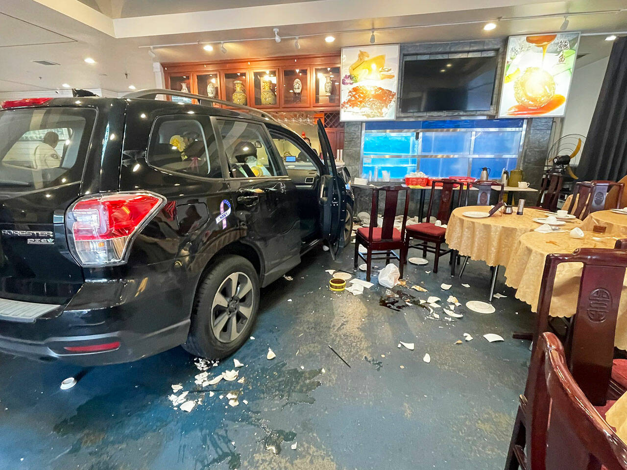 A car crashed into the Imperial Garden restaurant in Kent on Tuesday, August 13. Two people inside the restaurant were injured. Photo courtesy of Puget Sound Fire