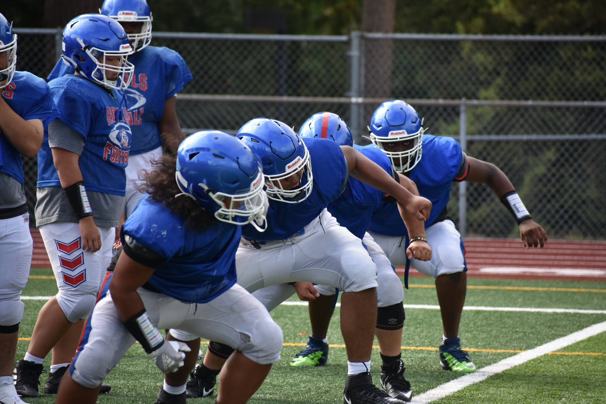 Linemen at Kent-Meridian put in the work. Ben Ray / The Reporter