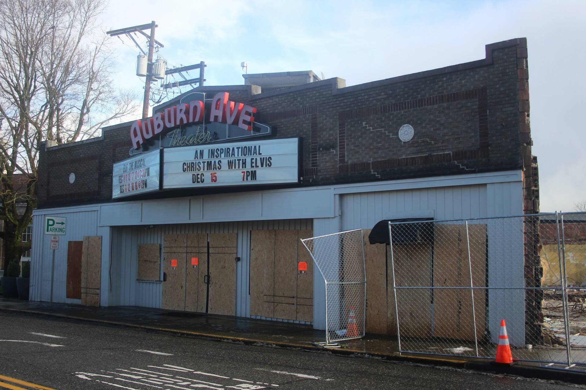 The Auburn Avenue Theater sits vacant and boarded up on Jan. 3, 2022, after being condemned due to safety concerns stemming from the demolition of the Max House Apartments complex next door. File photo