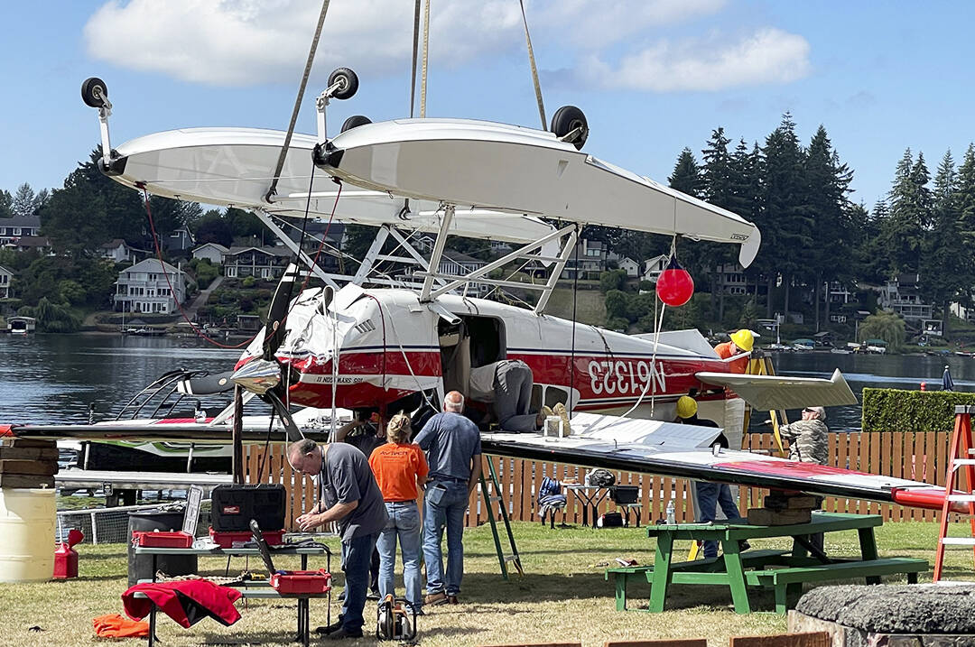 Crews remove the seaplane piloted by Alan Williams that crashed Aug. 24 into Lake Meridian. Williams, 74, died Aug. 29 at Harborview Medical Center in Seattle. COURTESY PHOTO, Puget Sound Fire