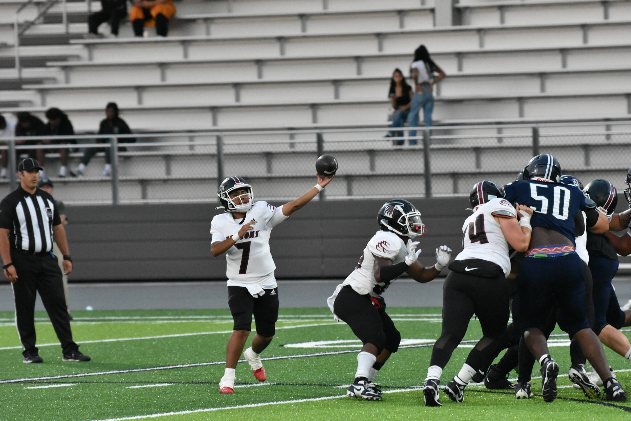 Kentlake QB Gavin Leenhiavue makes a throw at Federal Way Memorial Field. Ben Ray / The Reporter