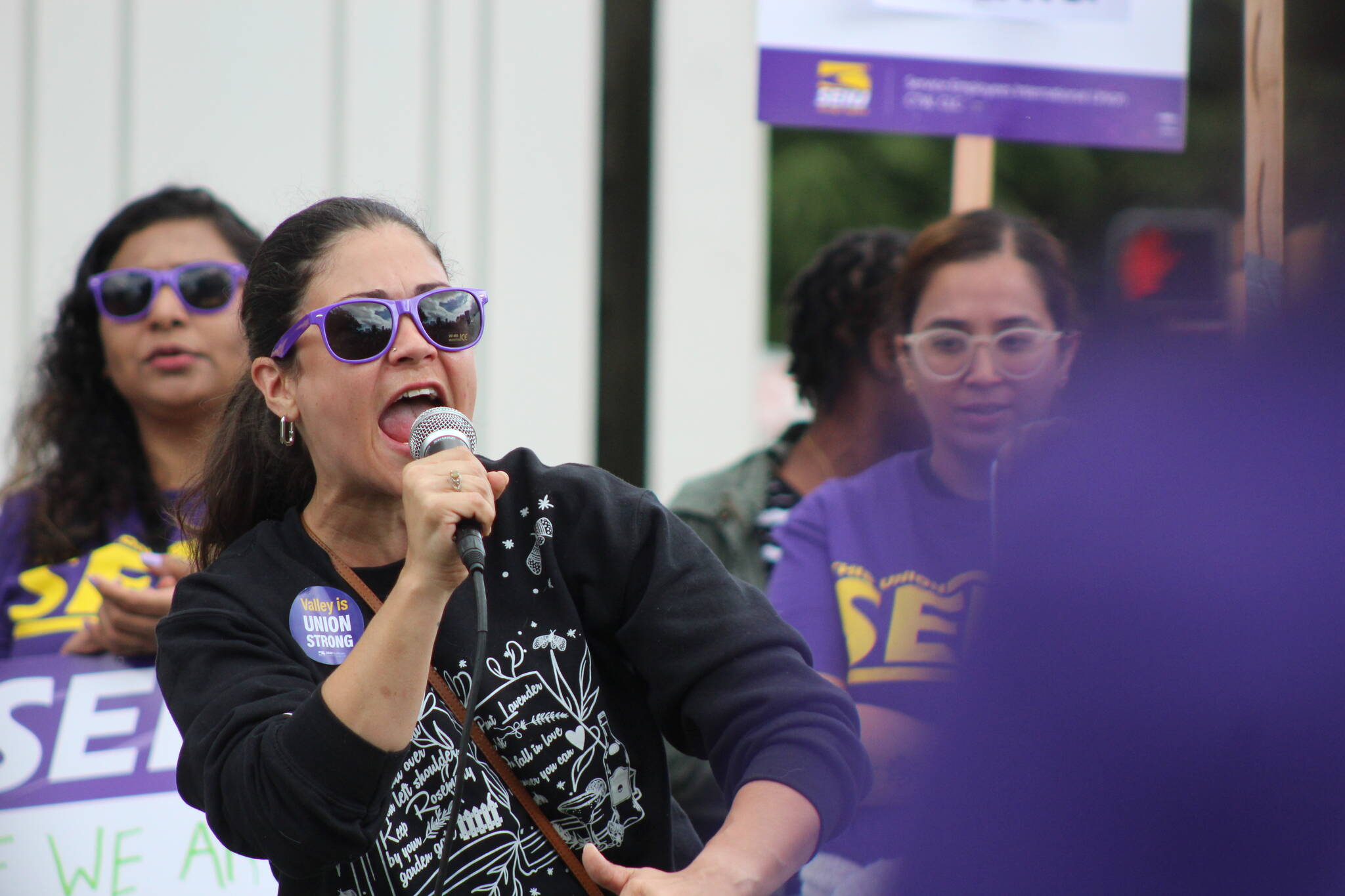 Renton City Councilmember Carmen Rivera passionately speaks to crowd, saying that she will fight for hospital workers.