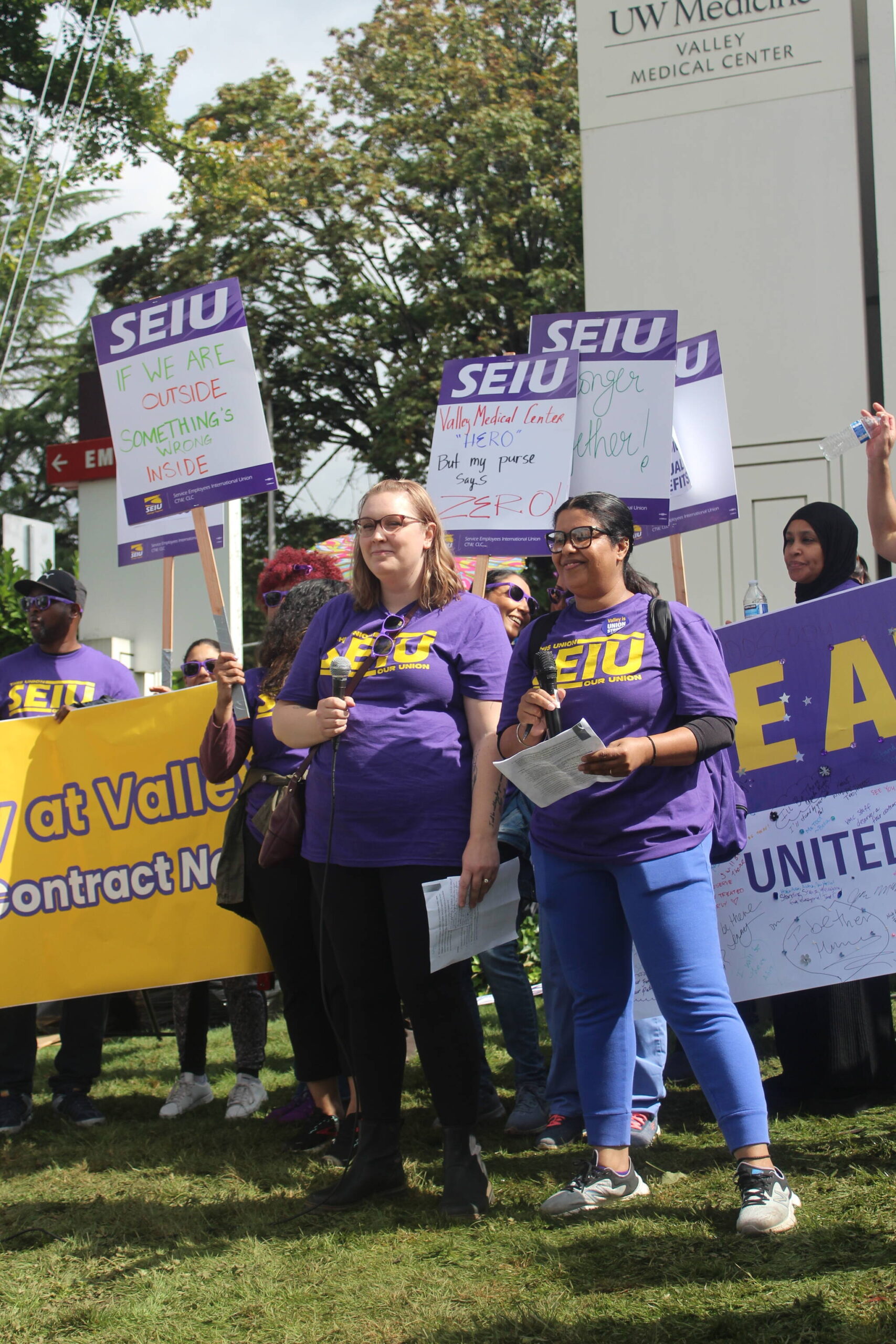 Jordan Middleton and Birpal Bhangu speak to the crowd at the informational picket. Photo by Bailey Jo Josie/Sound Publishing.