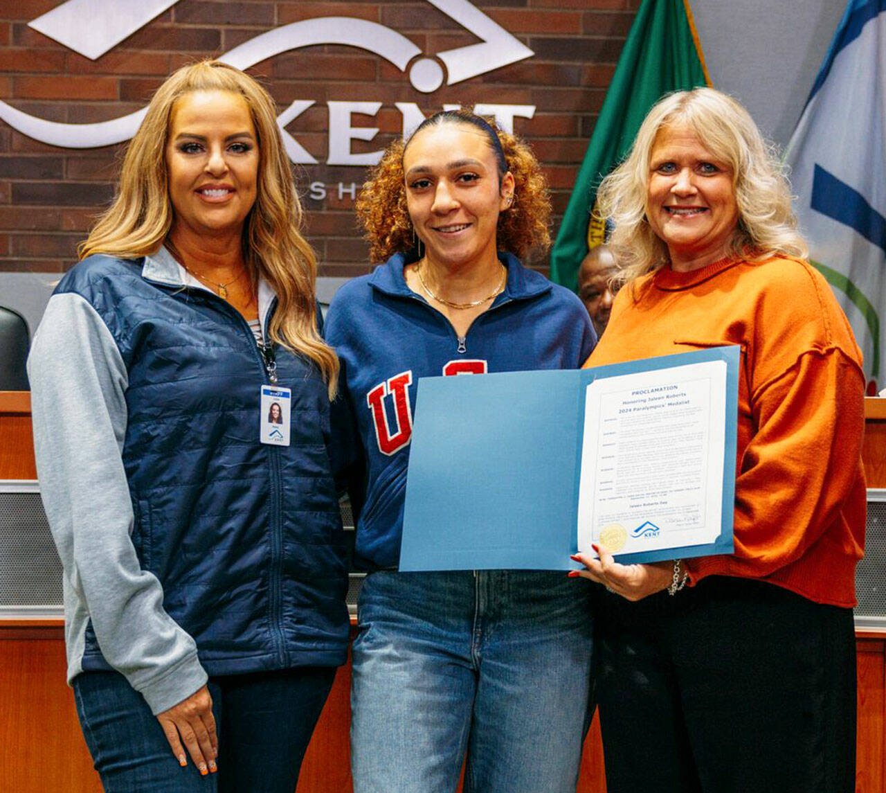 City of Kent Parks Director Julie Parascondola, left, and Mayor Dana Ralph recognize Paralympic medalist Jaleen Roberts at the Sept. 17 City Council meeting. COURTESY PHOTO, City of Kent