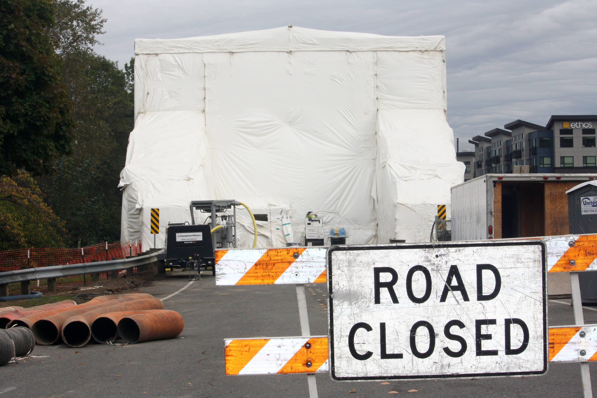 The Meeker Street bridge over the Green River in Kent remained closed for repainting Oct. 1. The covering is expected to be removed this week and the street and bridge reopened by Oct. 11. STEVE HUNTER, Kent Reporter