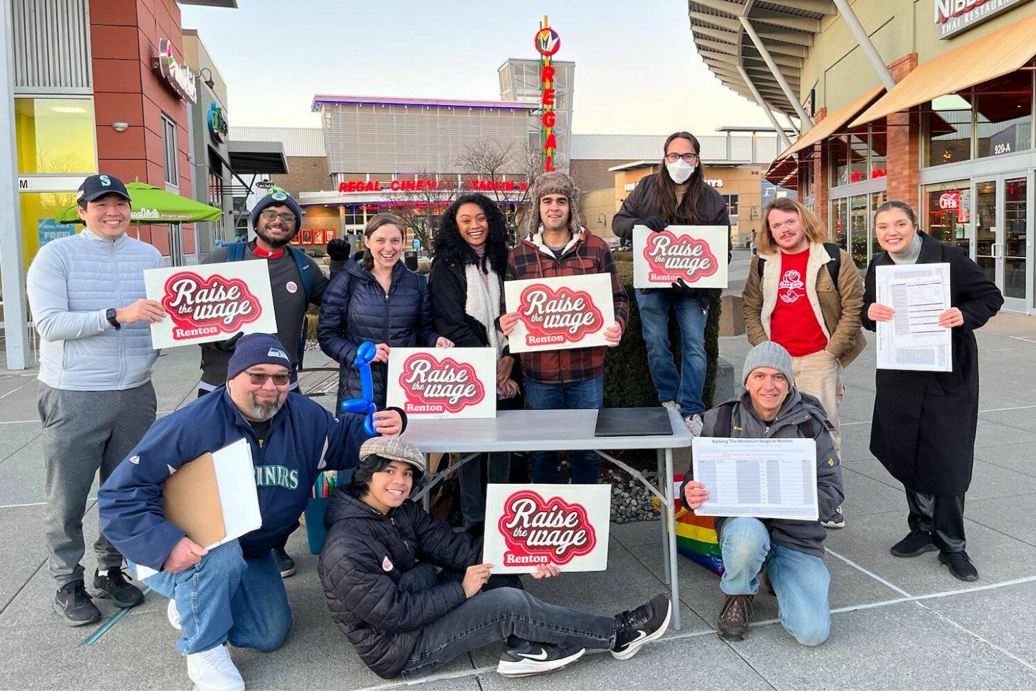 A group of volunteers from Raise the Wage Renton, shown gathering signatures in 2023. Renton residents approved a higher minimum wage for the city in a Feb. 2024 special election. (Photo courtesy of Raise the Wage Renton)