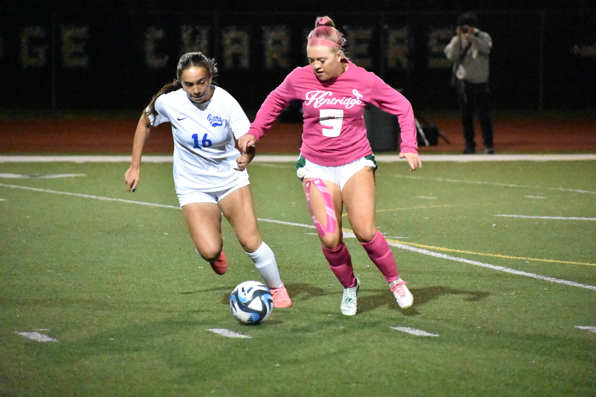 Makenna Bennett takes on a Tahoma player in a fight for possession. Ben Ray / The Reporter