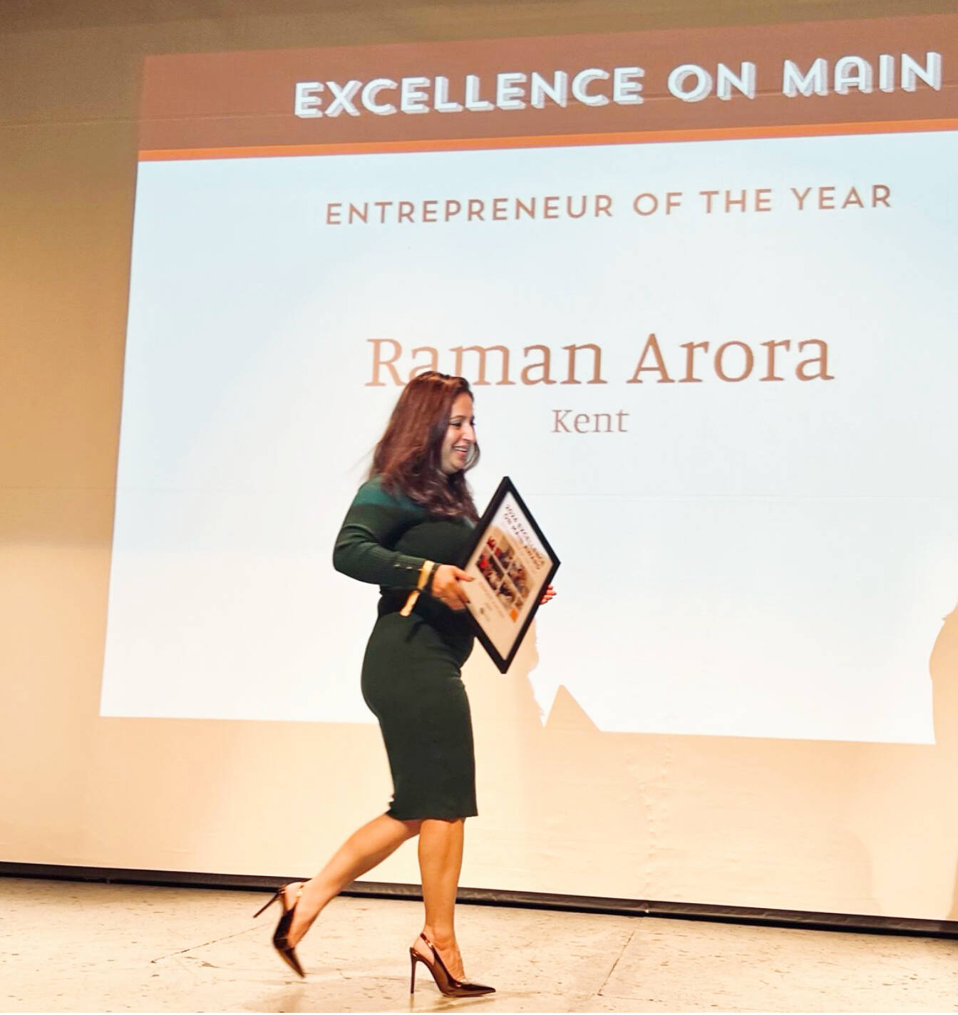 Raman Arora, the owner of Maggie’s on Meeker restaurant, accepting her Entrepreneur of the Year Award in Walla Walla. COURTESY PHOTO, Kent Downtown Partnership