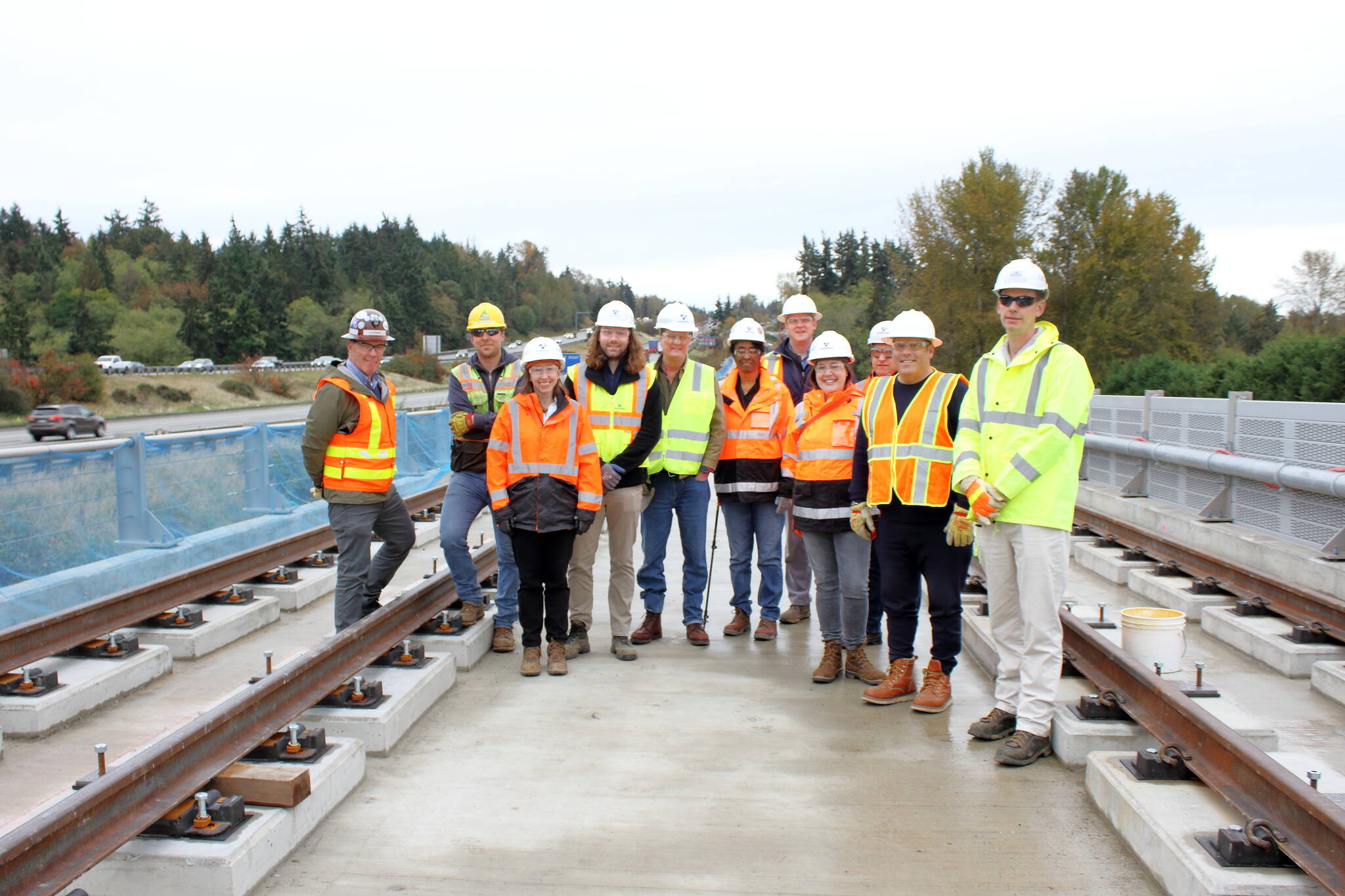 Federal Way Mayor Jim Ferrell and Sound Transit staff stand under Structure C in Kent which includes the longest light rail bridge built by Sound Transit. The bridge was completed recently and they are now moving to the next phase that focuses on the rail itself atop the bridge. KEELIN EVERLY-LANG, Sound Publishing