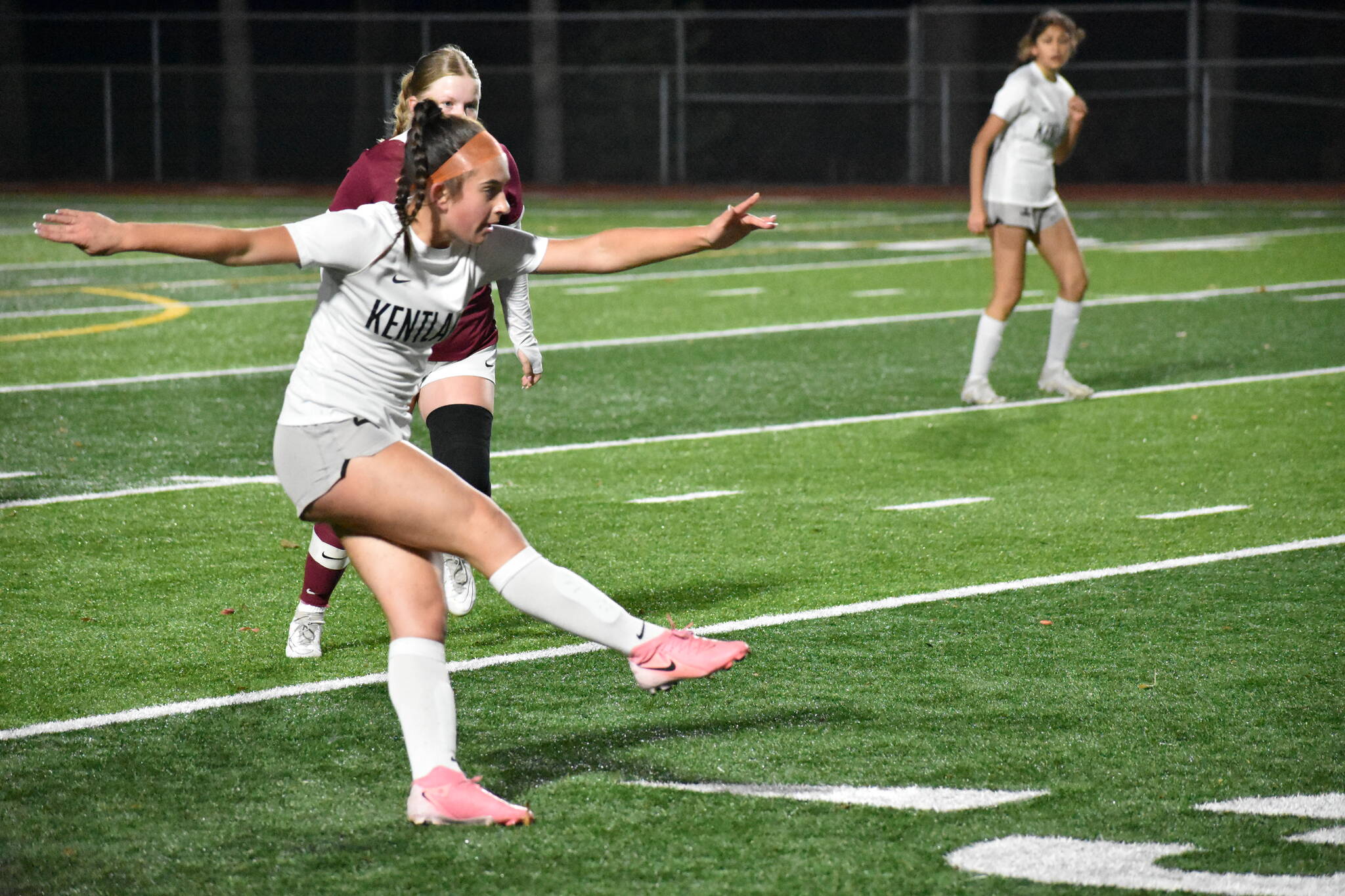 Lauren Tripp kicks the ball up-field for the Falcons. Ben Ray / The Reporter