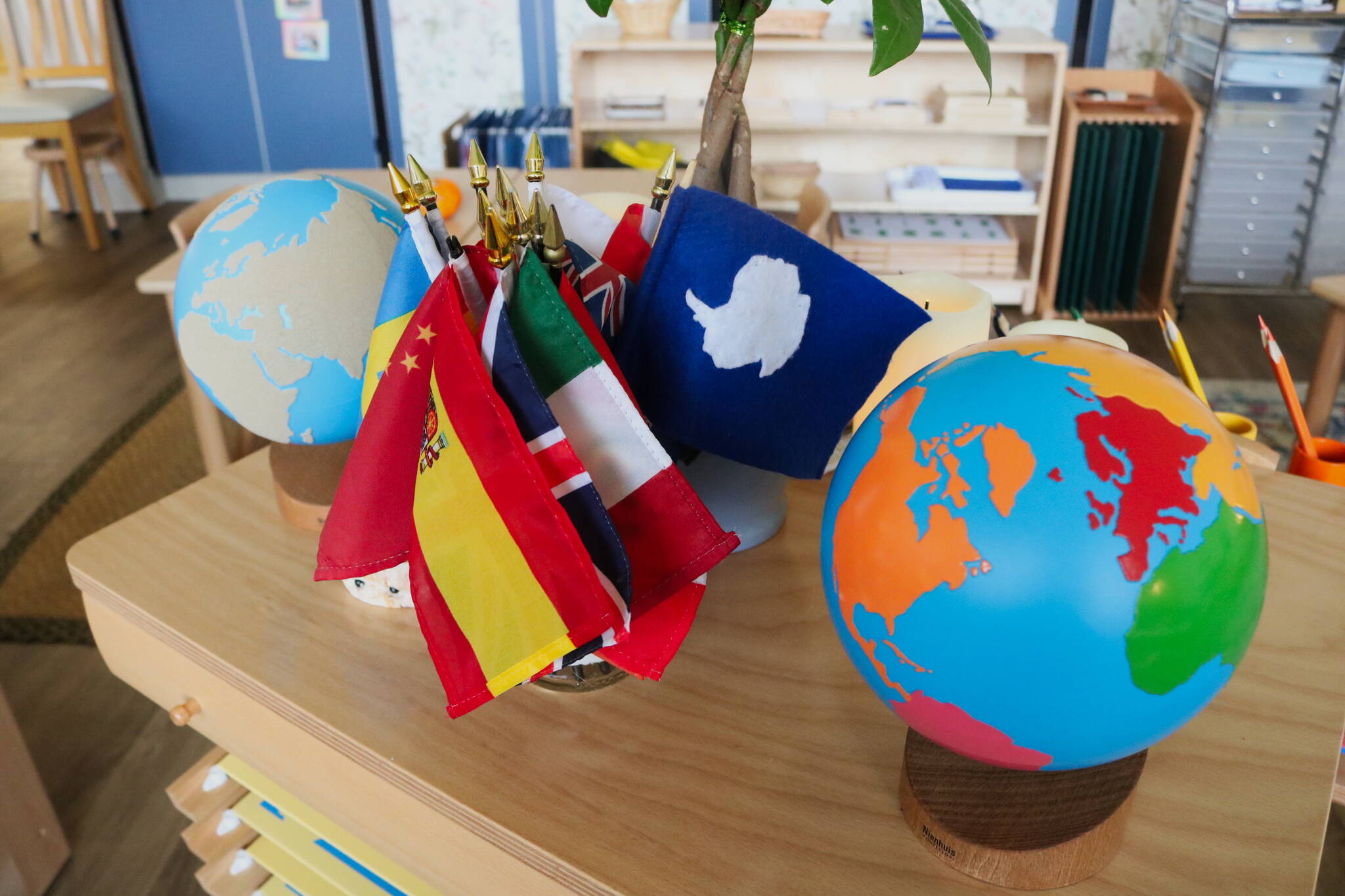 One classroom has students learn about the different flags and where they belong. One student asked for a flag of Antarctica, which the teacher gladly made by hand. Photo by Bailey Jo Josie/Sound Publishing.