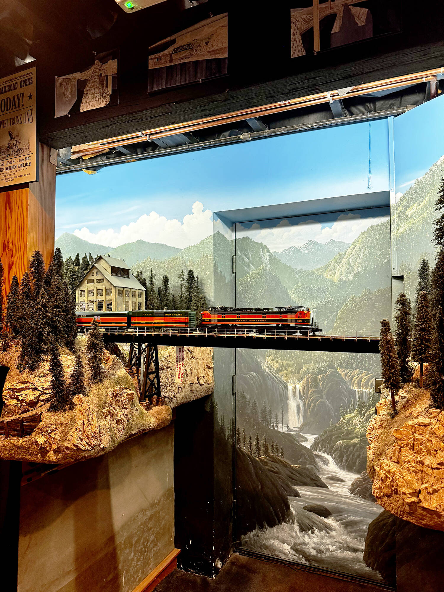 A model train crosses a bridge in front of the exterior door to Peter Hambling’s basement. The basement was built for this project. GRACE GORENFLO, Sound Publishing