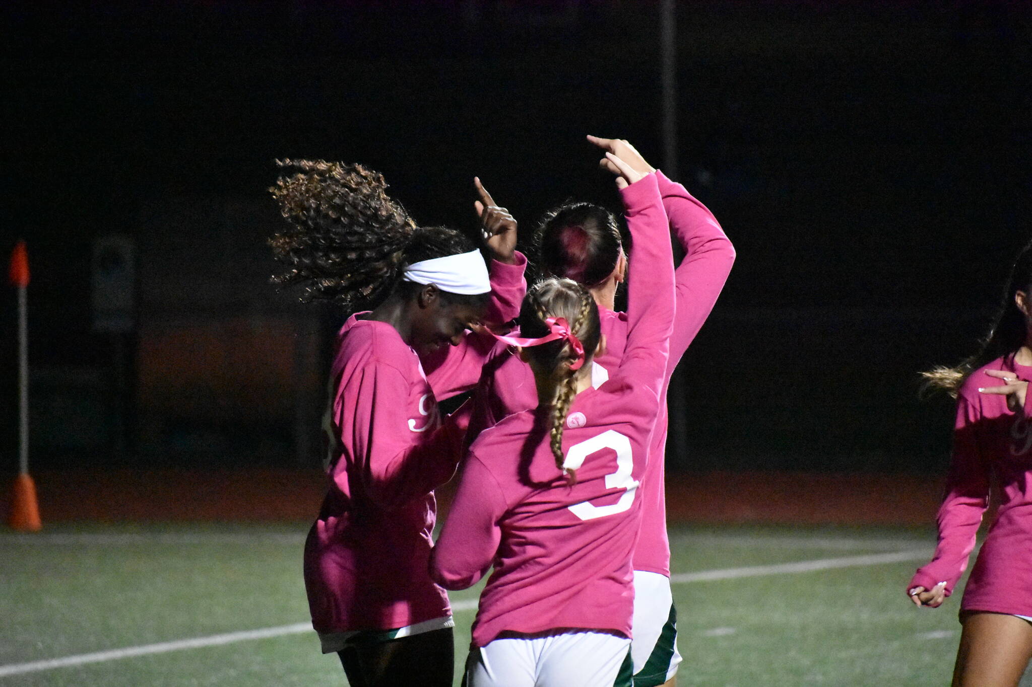 Three Chargers all dance after Shiney Mayanja scored her first goal of the night, Kentridge’s fifth. Ben Ray / Sound Publishing