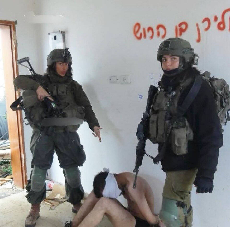 Kent Police say the department accidentally reposted this photo on its X account of what appears to be two Israel Defense Forces soldiers detaining a member of Hamas. COURTESY PHOTO