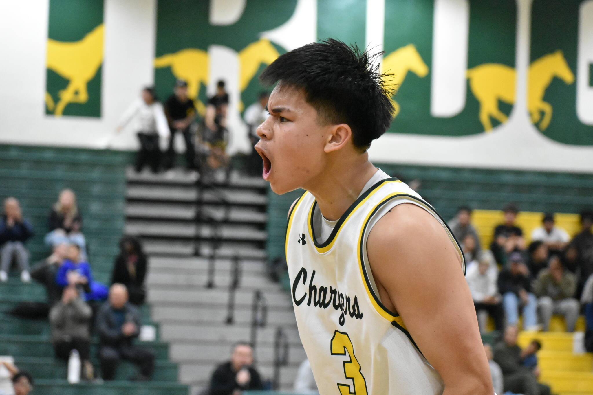 Kentridge senior Josh Manzano gives a yell after making his fourth three-pointer of the fourth quarter. Ben Ray / The Reporter