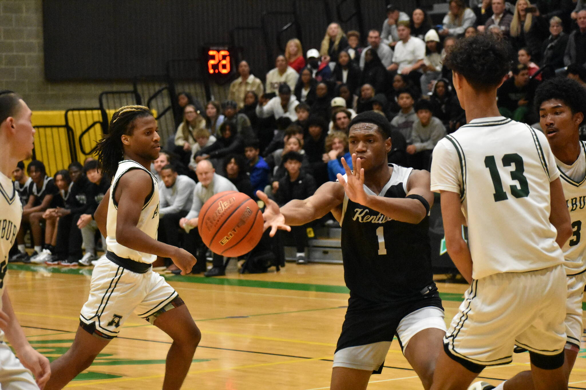 Kentwood senior Corey Tita makes a pass against Auburn. Ben Ray / The Reporter