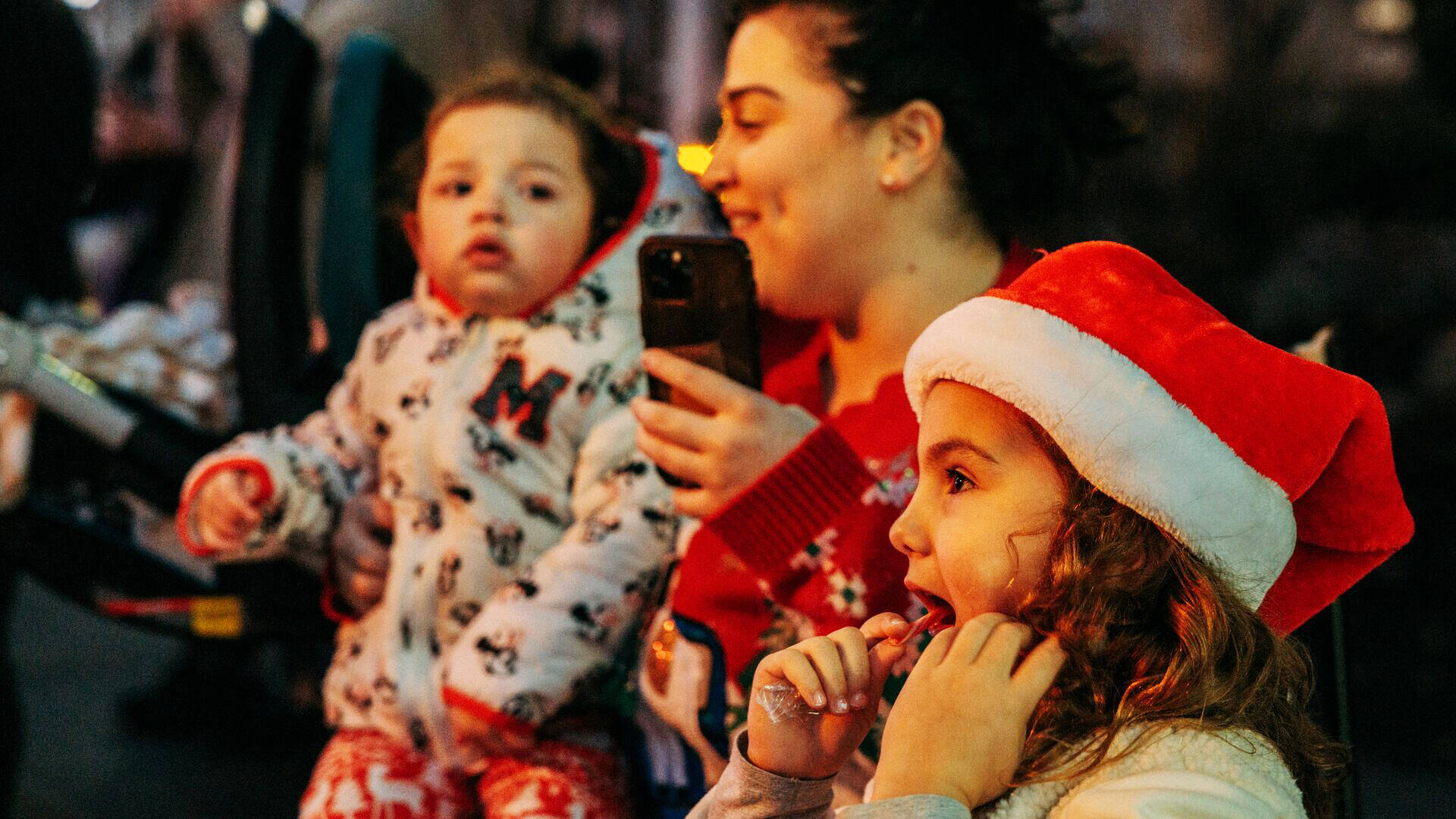 A family enjoys the Winterfest parade in downtown Kent. COURTESY PHOTO, City of Kent