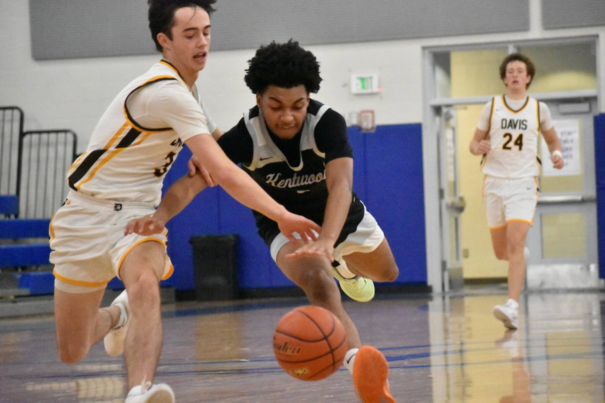 Mason St. Louis battles for a loose ball. Ben Ray / The Reporter