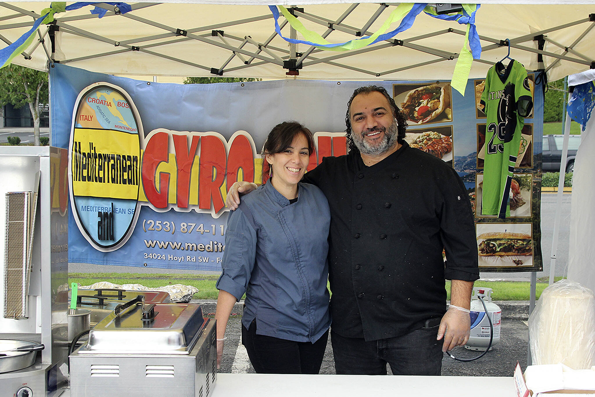 Mediterranean Gyro Grill owner Jay Barbour, right, and his restaurant manager pictured at the Taste of Federal Way in 2019. File photo