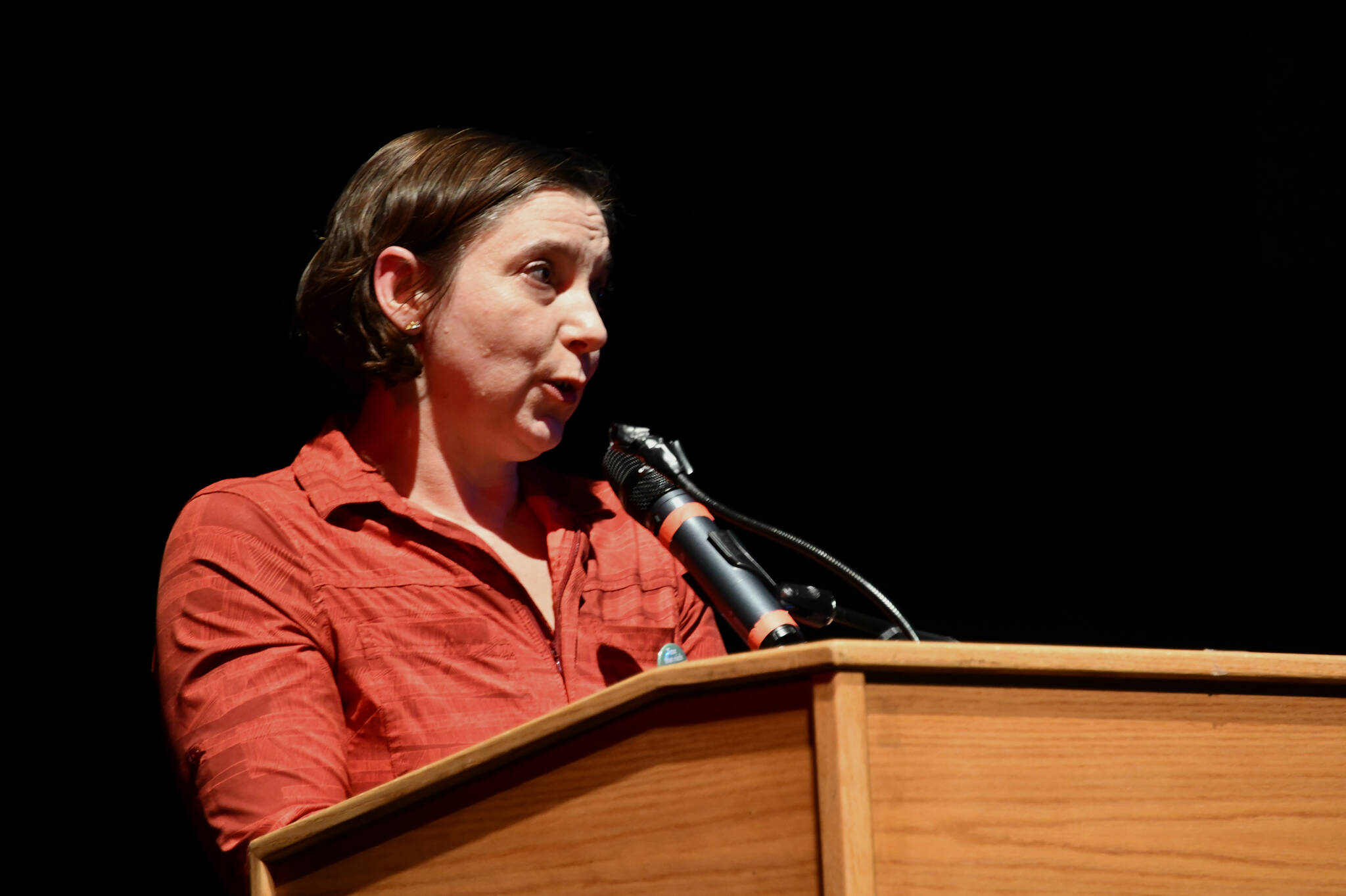 Julianna Dauble of the Renton Education Association addresses the crowd at the “School Funding Crisis” Eastside Town Hall on Jan. 8 at Sammamish High School in Bellevue. Andy Nystrom/ staff photo