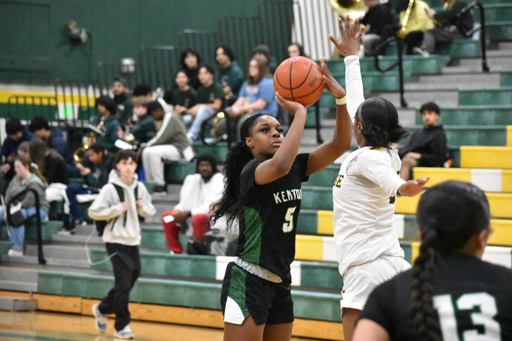 Kentwood’s Jessica Ajayi takes a three-pointer against Kentridge. Ben Ray / The Reporter